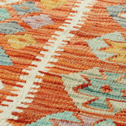 Close-up of a colorful woven textile with geometric pattern